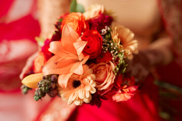 Bouquet, nature and wedding flowers with color for tradition, faith and closeup. Orange lily, roses and marriage with flora or floral for ceremony with bride, elegant and romantic in Pakistan.