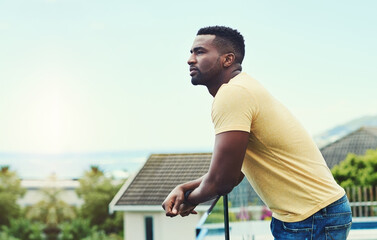 Black man, balcony and thinking to relax in outdoor, nature and weekend for rest on morning. Male...