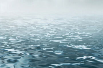 Obraz premium An abstract representation of gentle rain on a water surface, with subtle ripples. Tones of gray and soft blue dominate, creating a reflective and meditative quality.