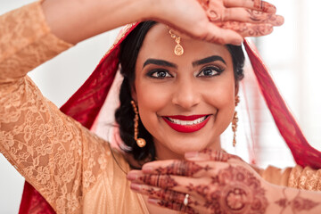 Indian bride, portrait and mehendi for wedding, celebration and love for marriage. Woman,...