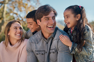 Summer, family and children together on vacation, people and happy for outdoor nature. Kids, man or woman outside bonding with siblings for embrace, support and caring parents for love at the park