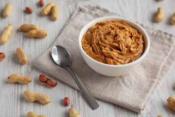 Organic Raw Peanut Butter in a Bowl, side view.