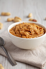 Organic Raw Peanut Butter in a Bowl, side view.