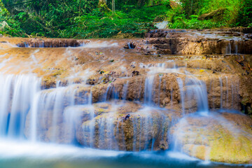 Water flows softly at Than Sawan Waterfall in Doi Phu Nang National Park