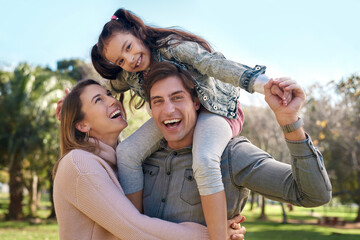 Family, parents and girl in park for piggyback, playing and bonding together with smile. Happy...
