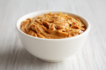 Organic Raw Peanut Butter in a Bowl, side view.