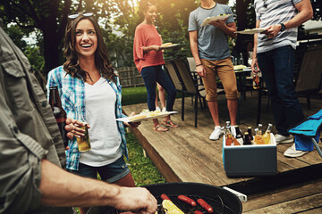 Outdoor, grill and woman with beer, talking and party for gathering in weekend, break and reunion....