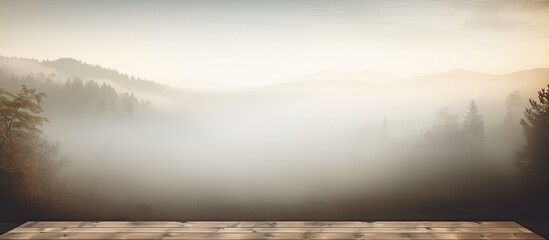 Nature morning mist provides a serene backdrop for a holiday message displayed on a wooden board with ample copy space image