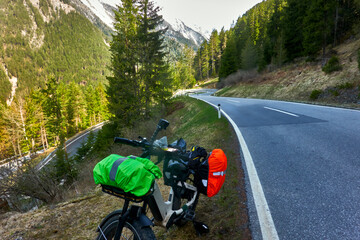 Heavily Loaded E-Fatbike on the Steep Winding Asphalt Road to Reschen Pass