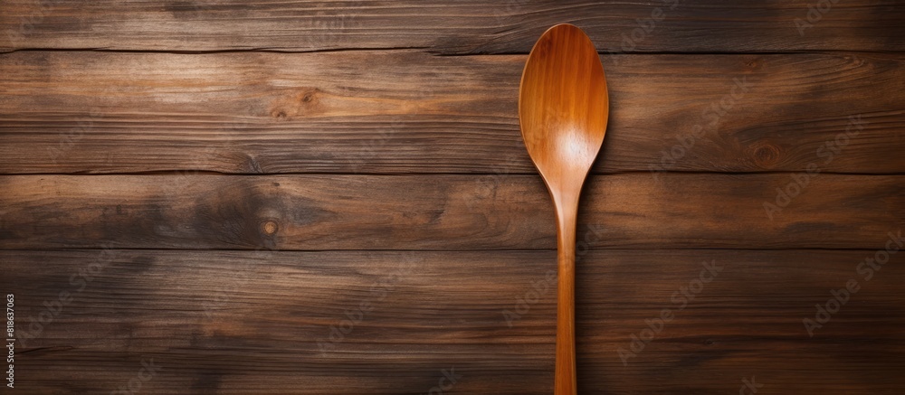 Aufkleber Copy space image of a wooden background adorned with a spoon and fork