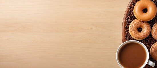 A top down view of a table with a coffee cup a donut and empty space for your text. Creative banner. Copyspace image