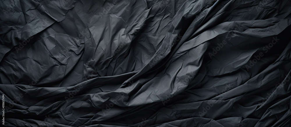Poster a crumpled piece of dark grey paper creates a textured background perfect for showcasing a copy spac