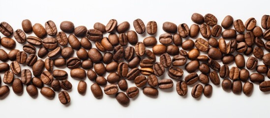 Naklejka premium A copy space image featuring coffee beans arranged on a white background