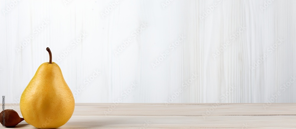 Poster A single pear is displayed on a white wooden table with a background that offers ample copy space for additional elements