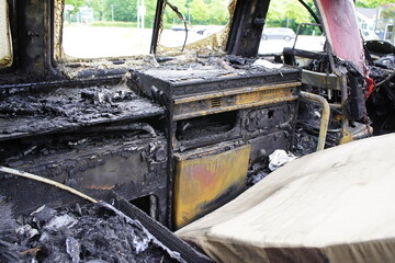 Burnt out minibus in Hannover - Stöcken, Germany on May 18, 2024