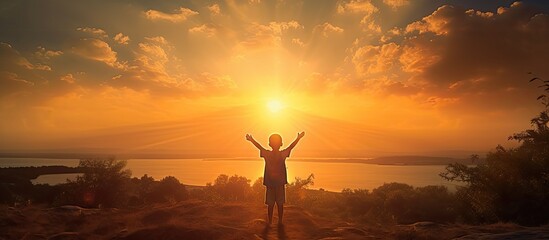 A child silhouette against the backdrop of a beautiful sunset capturing precious moments of pure joy Copy space image