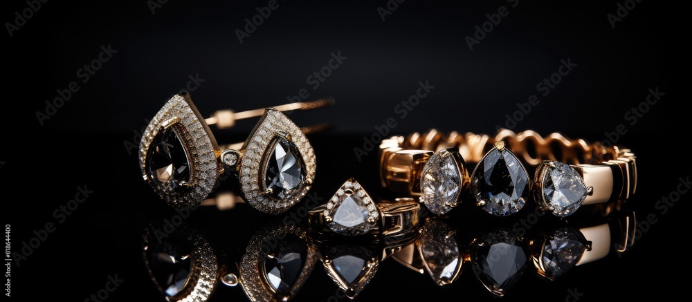 Poster luxurious jewelry with stylish studs displayed on a black background offering ample space for adding
