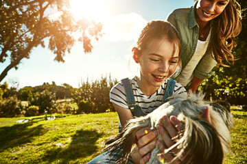 Outdoor, mother and girl with dog, happiness and sunshine with weekend break, animal and nature....