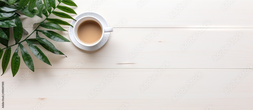 Poster A minimal workspace with a wireless keyboard coffee cup and plant on a white background providing room for a copy space image