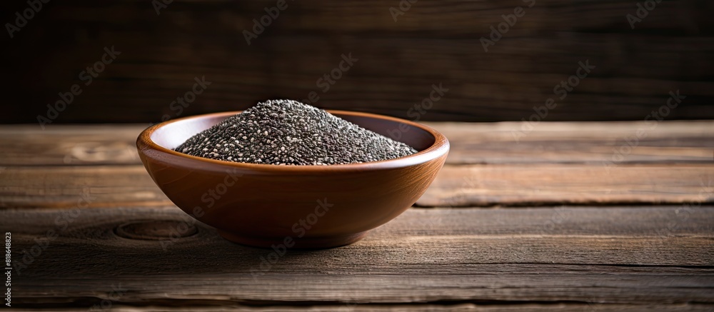 Aufkleber Chia seeds in a bowl with a wooden background creating a copy space image
