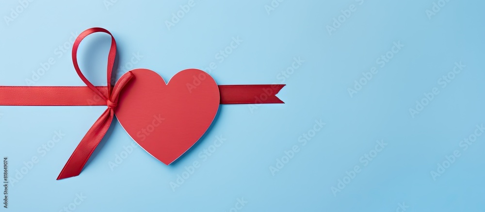 Poster A blue background hosts a heart shaped banner featuring a red empty tag tied with a ribbon bow and an accompanying envelope The setup offers a copy space image