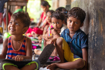 Anganwadi School Children Holding Slate, looking into camera, at school