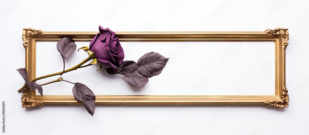 Aufkleber a dried purple rose is displayed in a golden frame against a clean white background allowing for cop