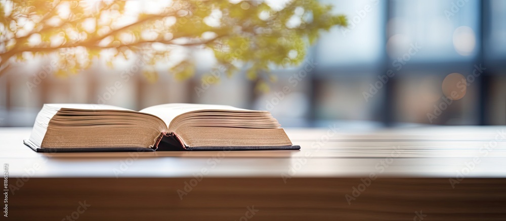 Poster Closeup of a wooden book in a library with a blurred background The image has copy space for text