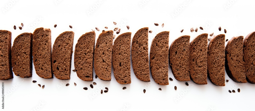 Poster A food background with a view from above showing decorative edging pieces of black rye bread on a white surface creating an isolated border pattern. with copy space image