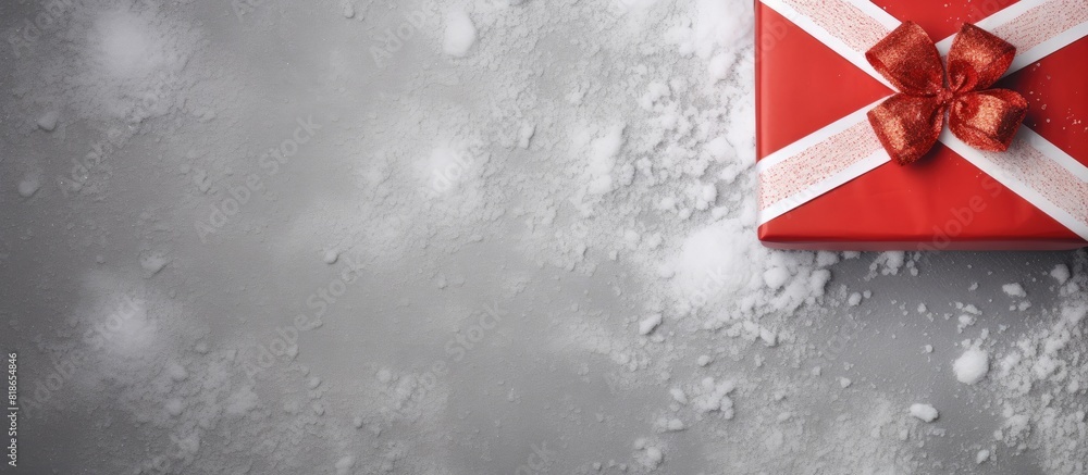 Poster A handmade box with red striped paper adorned with fir and snow represents the concept of Christmas and New Year Seen from above on a grey background there is ample copy space in the image