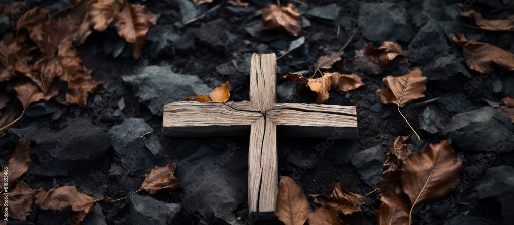 Fototapete a cross made of wood is positioned on the ground providing ample copy space in the image
