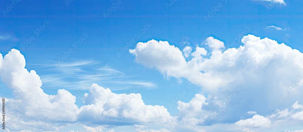 Poster background with a clear blue sky and white clouds perfect for copy space image