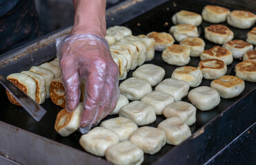 Fresh meat mooncakes on frying pan