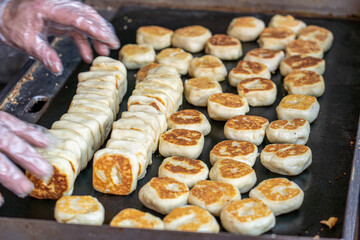 Fresh meat mooncakes on frying pan