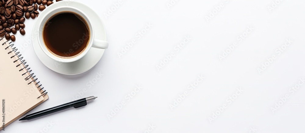 Aufkleber An overhead view of a flat arrangement on a white background featuring a diary book handphone keyboard and a cup of black coffee providing copy space