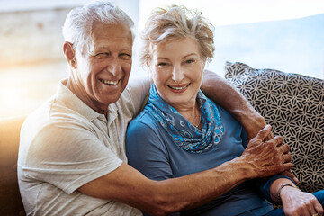 Portrait, hug and old couple on couch, love and bonding together with happiness, romance and...