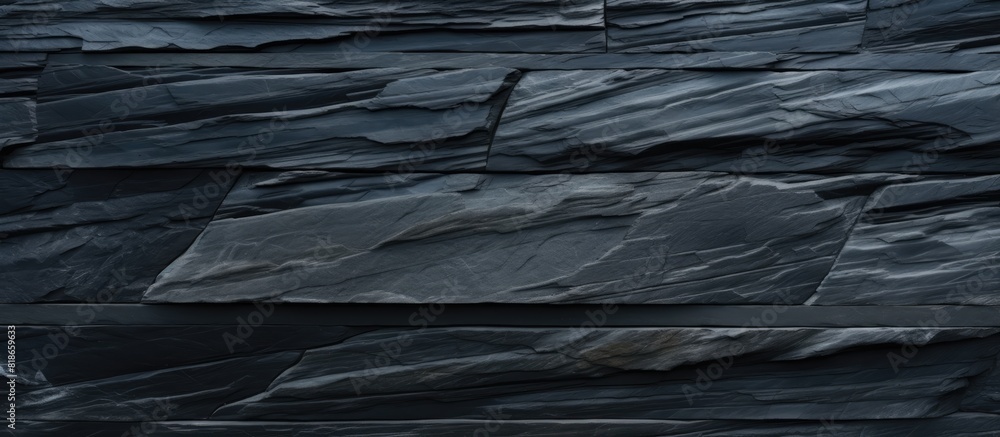 Poster high resolution top view of a patterned background made of natural black slate stone providing ample