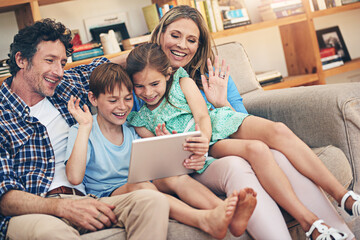 Happy family, video call and wave with tablet on sofa for communication or conversation together at...