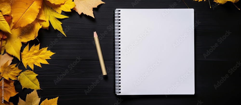 Poster flat lay copy space image with a dark background showcasing school supplies a white blank notebook s