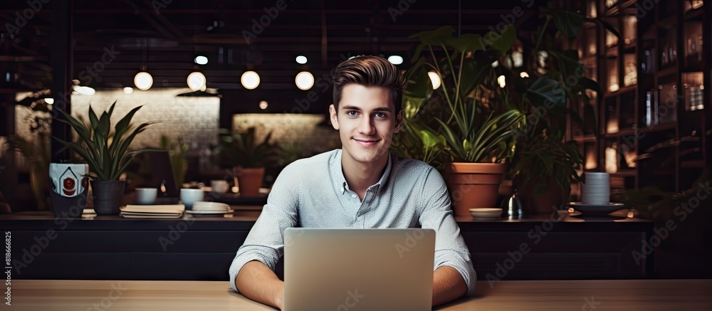 Aufkleber confident young manager working on a desk in a coffee shop captivated by the camera in a beautiful p