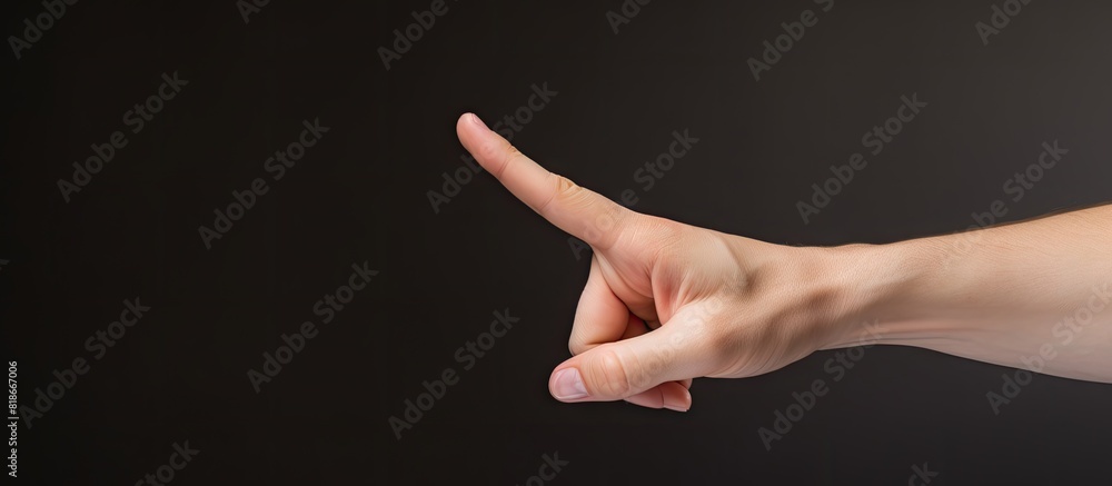 Poster The hand gesture of the isolated model on a plain background indicates a break sign Copy space image
