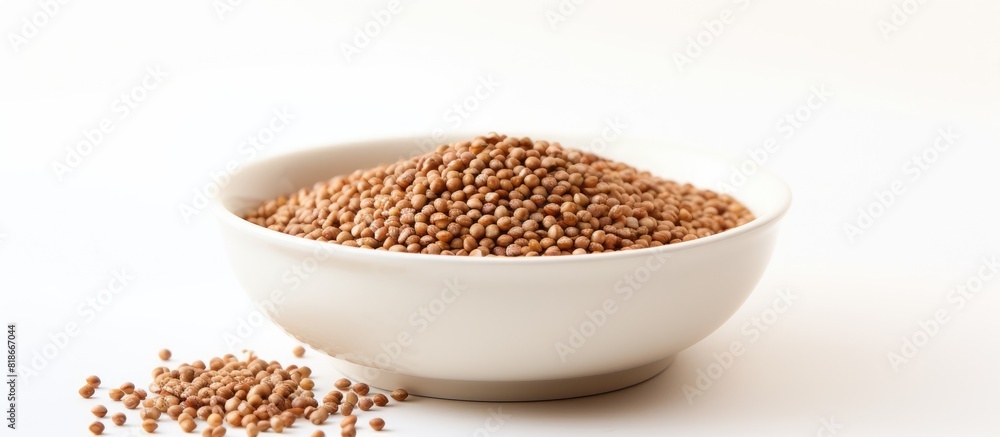 Poster a healthy organic cereal raw buckwheat is served in a bowl with a white background it can also be se