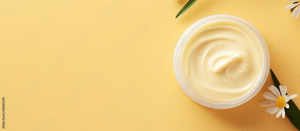 Aufkleber A jar of body butter is placed on a yellow background to create a copy space image This image represents a skin care product a natural cosmetic and the concept of cream The view is from the top with a