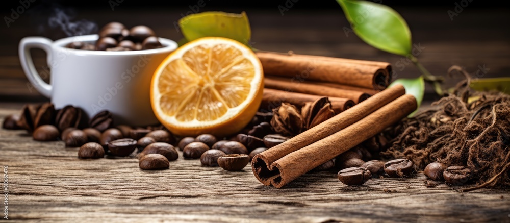 Leinwandbilder morning coffee concept with fragrant aromatic coffee beans accompanied by dry lemon and cinnamon sti