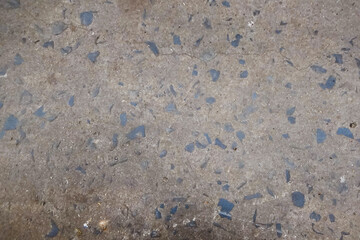 Background and texture of the road surface is made   cement and small stones.