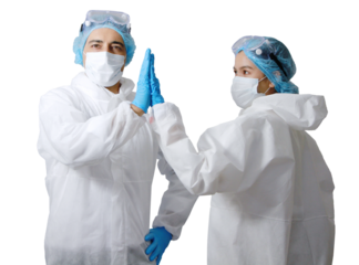 Medical team in personal protective equipment or PPE clothing is touching the hands to encourage together and healing for patient infected with the Covid19 virus in hospital 