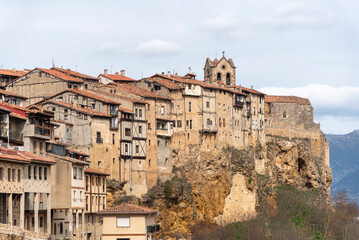 Obraz premium Panoramic view of the beautiful and touristic village of Frías in the province of Burgos, full of small houses of brick, wood and stone and in the background an impressive medieval church