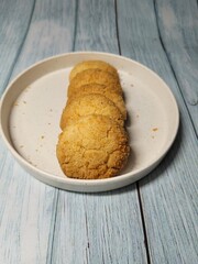 Indulge in the tropical flavors of a coconut cookie. Crisp, golden-brown perfection topped with shredded coconut. Temptation in every bite