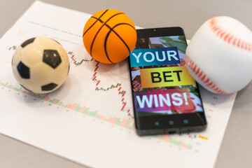 Football Business Concept. Ball and smartphone with bet application. Soccer gambling money concept