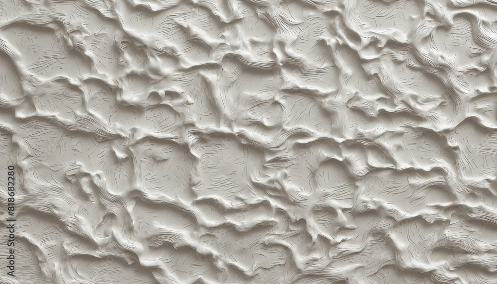 Poster the image is a close up of a sandy beach with a white wall in the background
